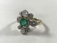 An 18ct gold emerald and diamond Art Nouveau style ring, size M/N.