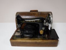 An oak cased Singer sewing machine