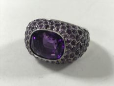 An 18ct white gold and amethyst cluster ring, 16.