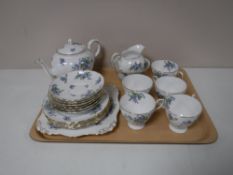 A tray containing a twenty one piece Tuscan forget me not tea set