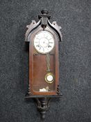 A continental mahogany cased wall clock