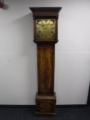 A mahogany longcase clock with brass dial and battery movement