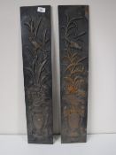 A pair of early 20th century cast iron panels