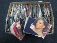 A box of 45 singles : 70's and 80's including Sex Pistols, The Police,