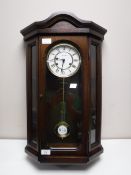 A mahogany cased Canterbury wall clock