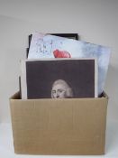 Two boxes containing a large quantity of assorted pictures and prints, wall canvases,