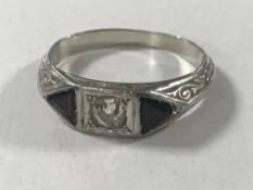 A platinum diamond and sapphire ring