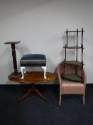 A pink loom basket chair together with a four tier corner whatnot stand, a plant table,