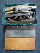 A box containing woodworking tools, tile cutter,