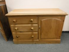 A Victorian style pine cabinet, fitted with three drawers,