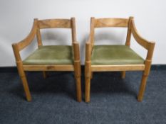 A pair of oak armchairs