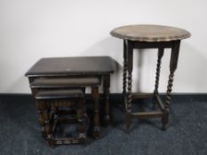 A nest of three oak Ercol tables together with an oak barleytwist occasional table