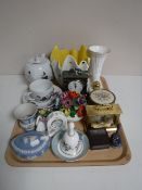 A tray containing contemporary mantel clocks, china flower posies, Wedgwood Jasperware,