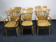 A set of six pine kitchen chairs, comprising of four armchairs,