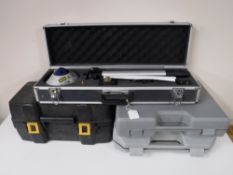 A cased B&Q laser level together with a cased Pro sander,