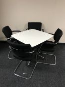 A contemporary square office table on chrome legs together with a set of Senator chrome framed