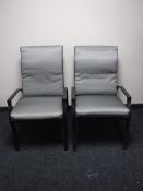 A pair of metal adjustable garden armchairs with cushions