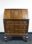 An early twentieth century oak writing bureau