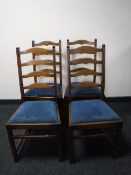 A set of four oak ladder back chairs