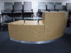 A contemporary twin section corner reception desk