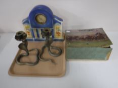 A tray containing a vintage Escalado game together with a pair of brass candlesticks in the form of