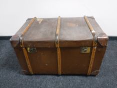 A large wooden bound shipping trunk
