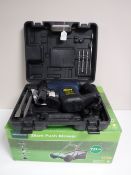 A boxed Powercraft hammer drill and a Gardenline push mower