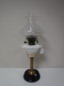 An antique brass and china oil lamp stamped Williams & Bach New Bond Street, London