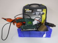 A crate containing a Challenge Extreme Cordless Hammer Drill, electric hedge trimmer, a JMB sander,