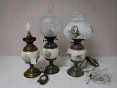 Two brass and china oil lamps with chimneys and shades (converted)
