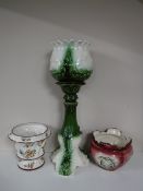A green pottery jardiniere on stand together with a Capodimonte jardiniere and one other