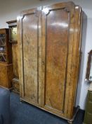 An early 20th century walnut double door wardrobe