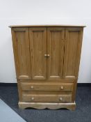 A pine double door television cabinet