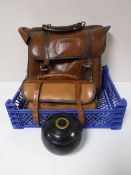 A set of four lawn bowls in leather case,
