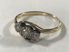 An early twentieth century diamond three stone ring, approximately 0.25ct, size O/P, 2.3g.