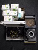 A box containing ink cartridges, camera lens,