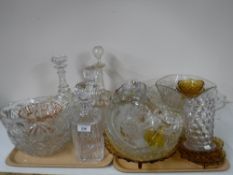 Two trays containing four decanters with stoppers, pressed glass fruit bowls,