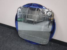 A frameless Art Deco two-tone mirror CONDITION REPORT: 61cm by 61cm.