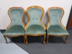 A set of three pine frame lady's chairs upholstered in a green dralon