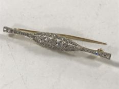 An 18ct gold diamond set bar brooch