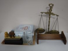 A set of brass balance scales together with a small mahogany book trough and a tray containing