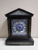 A Victorian ebonised cased mantel clock with blue porcelain dial