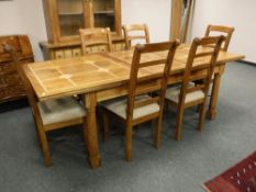 A Barker and Stonehouse Flagstone extending dining room table, together with six chair,