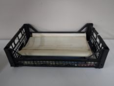 A basket containing a Univeristy of Newcastle Upon Tyne archive teaching unit folder, The Tyne,