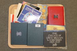 A large quantity of proof and specimen coin sets