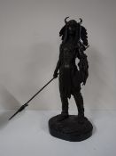 A bronze figure of a warrior on marble base