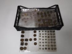 A crate containing a large quantity of early twentieth century and later British coins