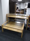 A contemporary glass topped two tier coffee table and a side table (2)