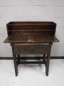 A stained pine side table fitted a drawer