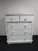 A painted antique pine five drawer chest